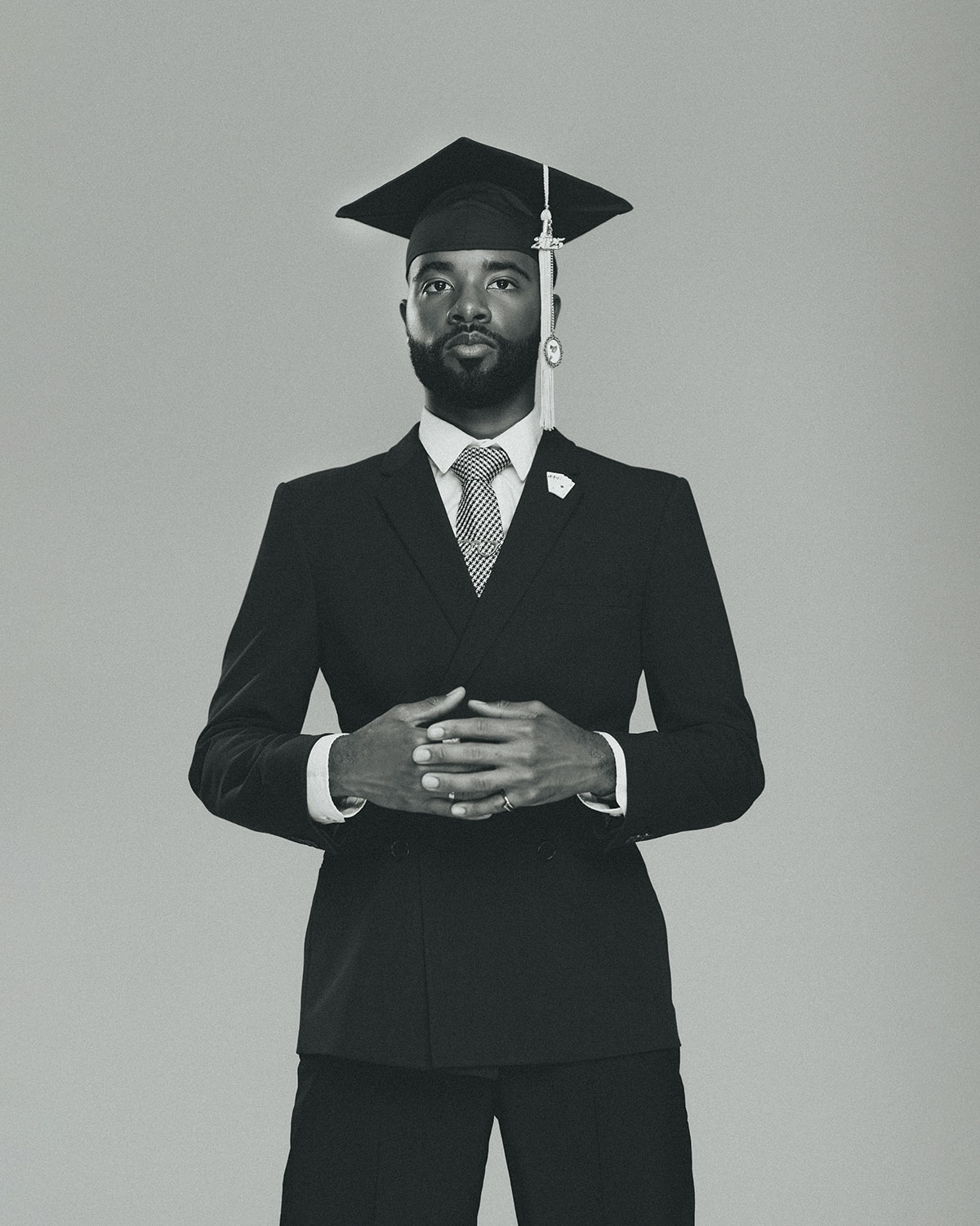 Graduate in cap and gown, Soba Studios Dallas