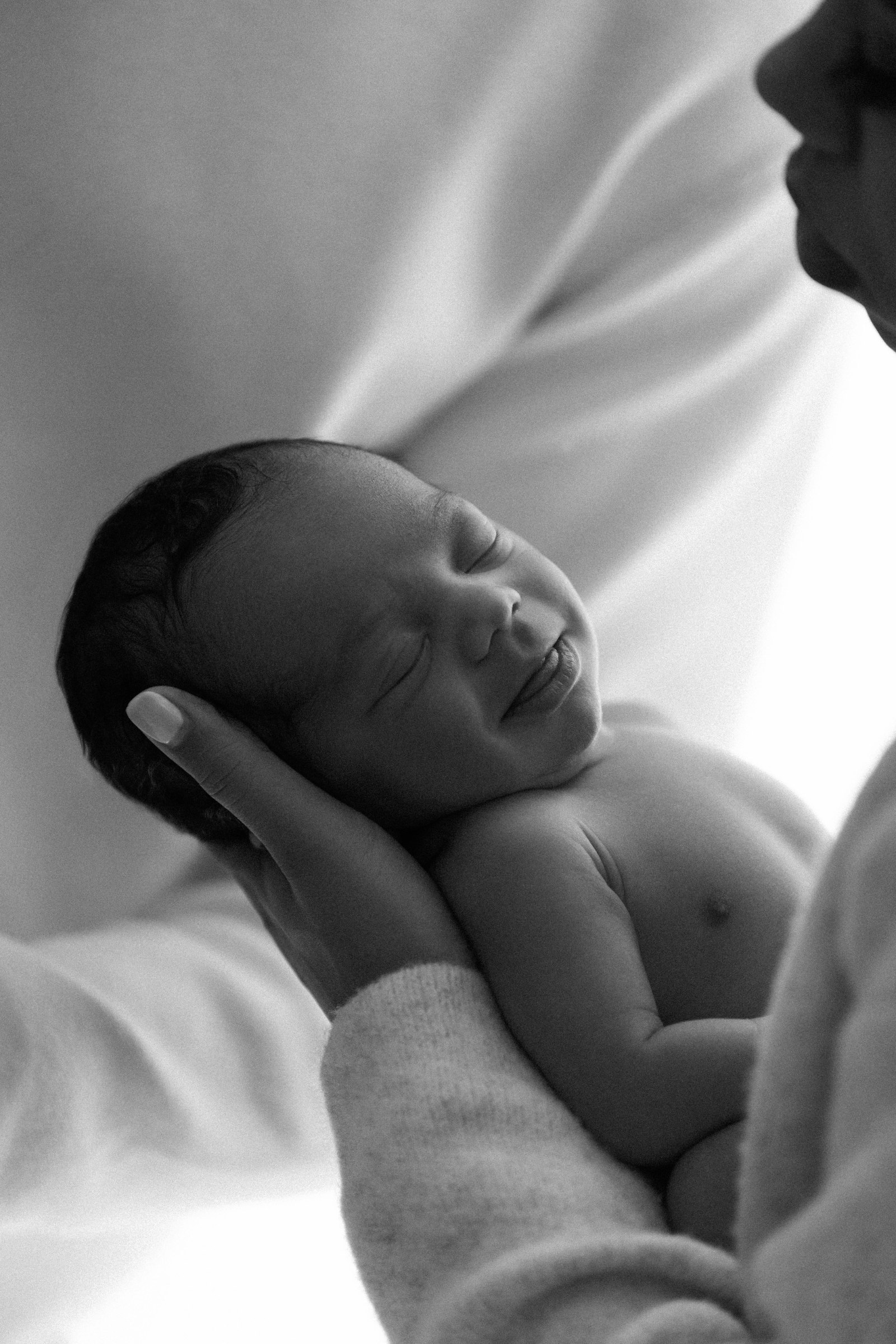 Newborn in her mother’s hands, Soba Maternity Dallas